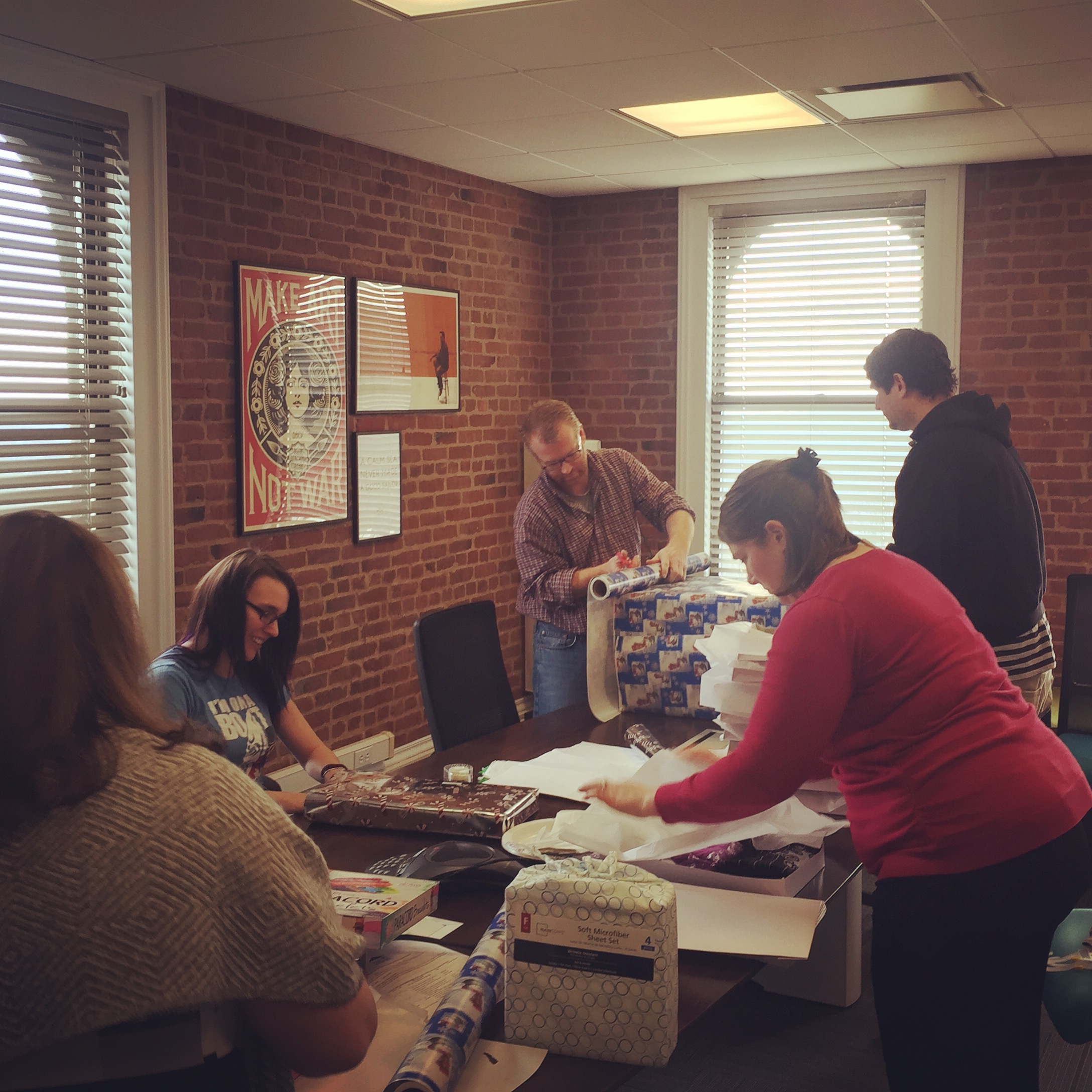 iMedia team wrapping holiday gifts